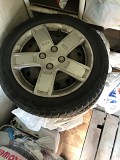 шины и диски с колпаками 185/60R15 на авео б/у. Состояние хорошее. оригинальные Запорожье